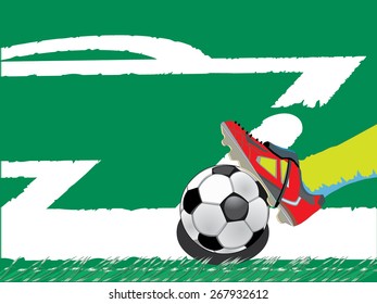 A football player's foot touching a football ball on a green grass stadium