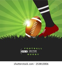 Football or rugby player with ball on grass  background