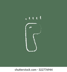 Footprint hand drawn in chalk on a blackboard vector white icon isolated on a green background.