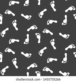 Footprint silhouettes vector seamless pattern black monochrome print.