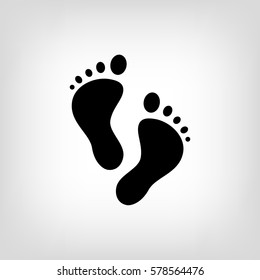 Footprint vector icon isolated on grey background. Black silhouette of feet print. Vector illustration