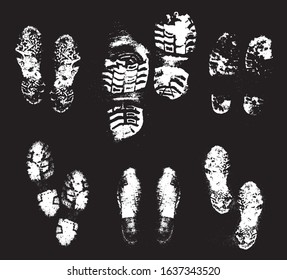 Footprints human shoes silhouette set in snow . Design Element . Traces of Boot . Mud grunge texture