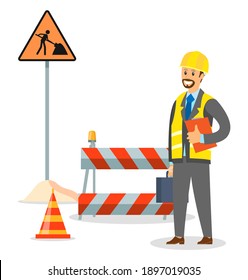 Foreman on the road repair section. Male engineer in hard hat. Maintenance and construction of pavement concept. Special equipment for fencing the way. Street barrier for roadwork and building