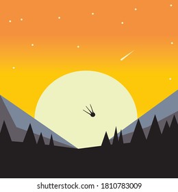Forest against the backdrop of mountains and sunset