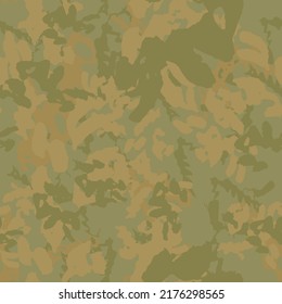 Forest camouflage of various shades of green and beige colors. It is a colorful seamless pattern that can be used as a camo print for clothing and background and backdrop or computer wallpaper