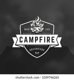 Forest camping logo emblem vector illustration. Outdoor adventure leisure, Campfire silhouette, print stamp. Vintage typography badge design.