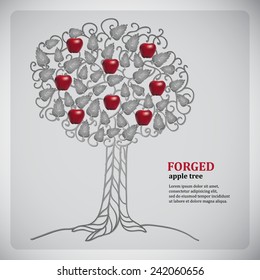 Forged metall tree with red apples and leaves