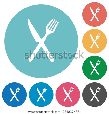 Fork and knife in crossed position flat white icons on round color backgrounds