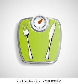 Fork and knife lying on the scales for weighing.