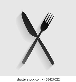 Fork and Knife sign. Black paper with shadow on gray background.