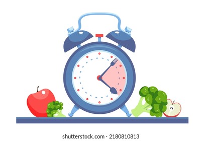 the fork and spoon  like clock hands. retro alarm clock and healthy food. healthy eating concept. Clock hands show intermittent fasting