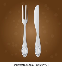Fork and table knife on a brown background with circles. Pattern on a fork and table knife