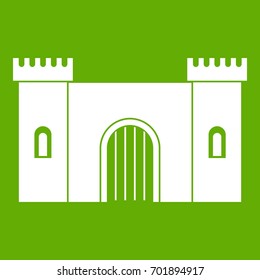Fortress with gate icon white isolated on green background. Vector illustration