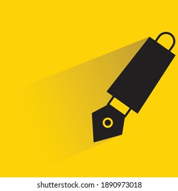 fountain pen with shadow on yellow background