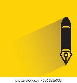 fountain pen with shadow on yellow background