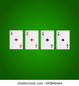 Four aces. Playing cards isolated on green background.