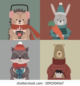 cuatro animales con ropas de invierno