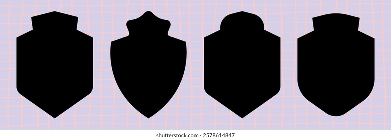 Four black shield silhouettes on a light grid background. Each shield silhouette has a unique shape. Shields in silhouette form create a bold visual. Element vector set.