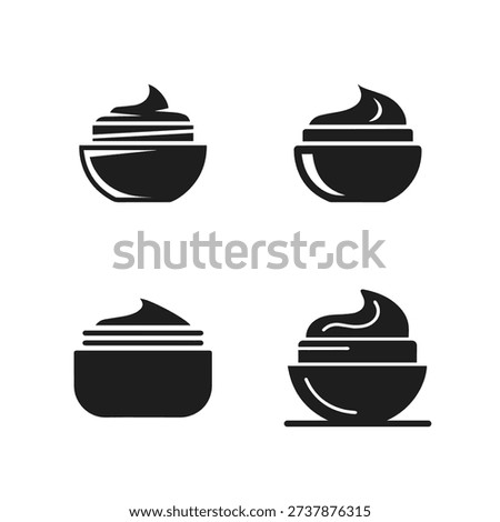 Four Black Silhouettes of Cream Jars, Representing Skincare Products and Cosmetics Packaging.