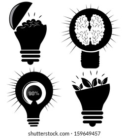 four black silhouettes of light bulbs with different elements inside them