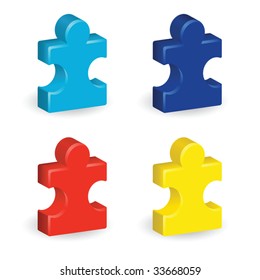 Four brightly colored, three-dimensional puzzle pieces, representing autism awareness
