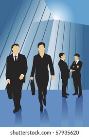 Four business people acting in front of glass building, a male and a female walking forward with briefcases and two men in conversation one gesticulating and one with his hands crossed.
