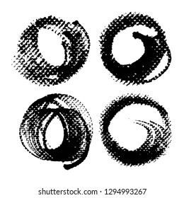 Four circle abstract textured black ink strokes and stamps isolated on a white background
