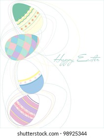 four colored eggs lie on each other
