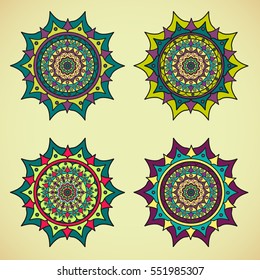 Four colored mandalas on a on light background