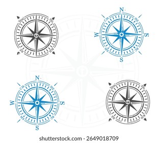 Four compass rose designs, two in blue and two in gray, arranged symmetrically on a white background.