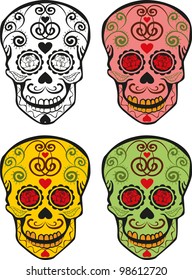 four different colors of sugar skulls
