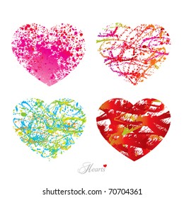Four different hearts with drops, spots and sprays from a brush. Vector illustration.
