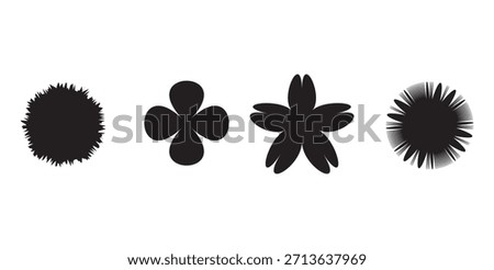 Four distinct black shapes resembling brush strokes or flower petals on a plain white background