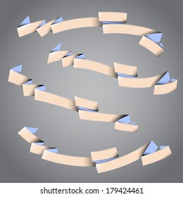 Four empty paper striped ribbons on the gray background