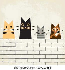 Four funny cats sitting on brick wall