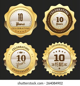 Four gold celebrating 10 years badges