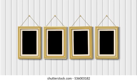 four gold picture frames on white