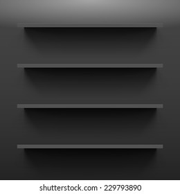 Four gorizontal black bookshelves on the dark wall