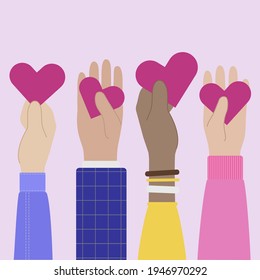 Four hands of people holding red hearts. 