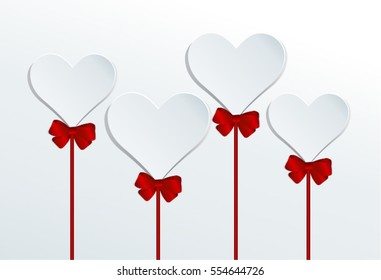 Four hearts on a stick, Valentine's Day background. Red gift bow with ribbon and heart  with space for text.
