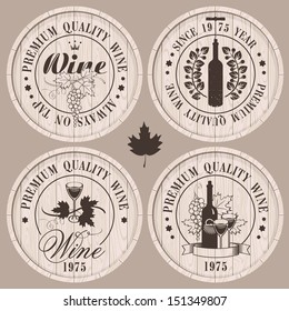 four labels for wine on wooden casks