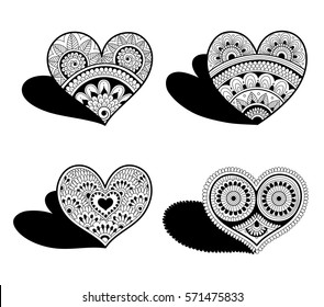 Four lace hearts in Indian mehndi style. Decorative elements for Valentine's Day.