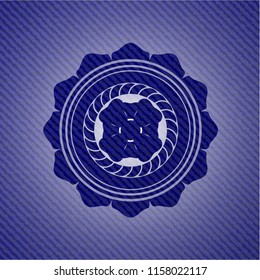 four leaf clover icon inside emblem with jean texture