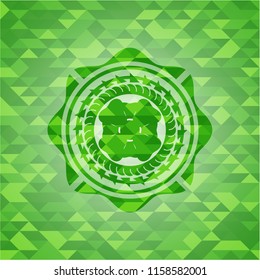 four leaf clover icon inside realistic green emblem. Mosaic background