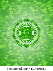 four leaf clover icon inside green mosaic emblem
