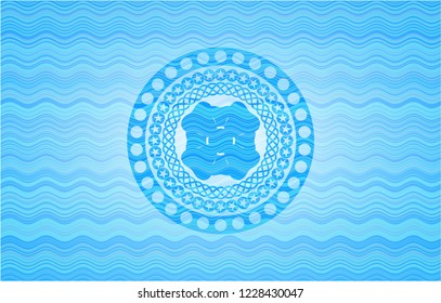 four leaf clover icon inside sky blue water badge.