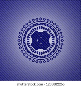 four leaf clover icon inside emblem with denim texture