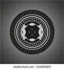 four leaf clover icon inside dark badge or emblem