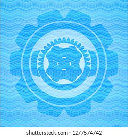 four leaf clover icon inside light blue water style emblem.