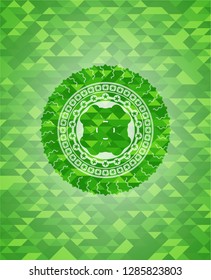 four leaf clover icon inside green emblem with mosaic background
